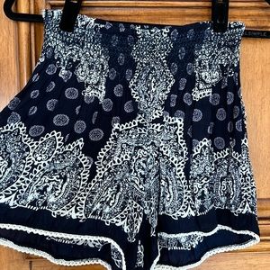 Sassy summer shorts. Navy and white print with smocked waist.